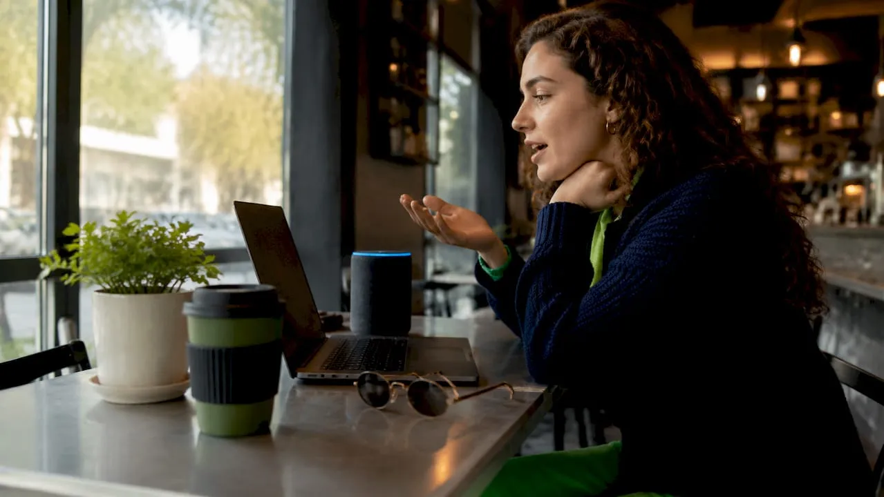 Woman using smart speaker for ecommerce browsing