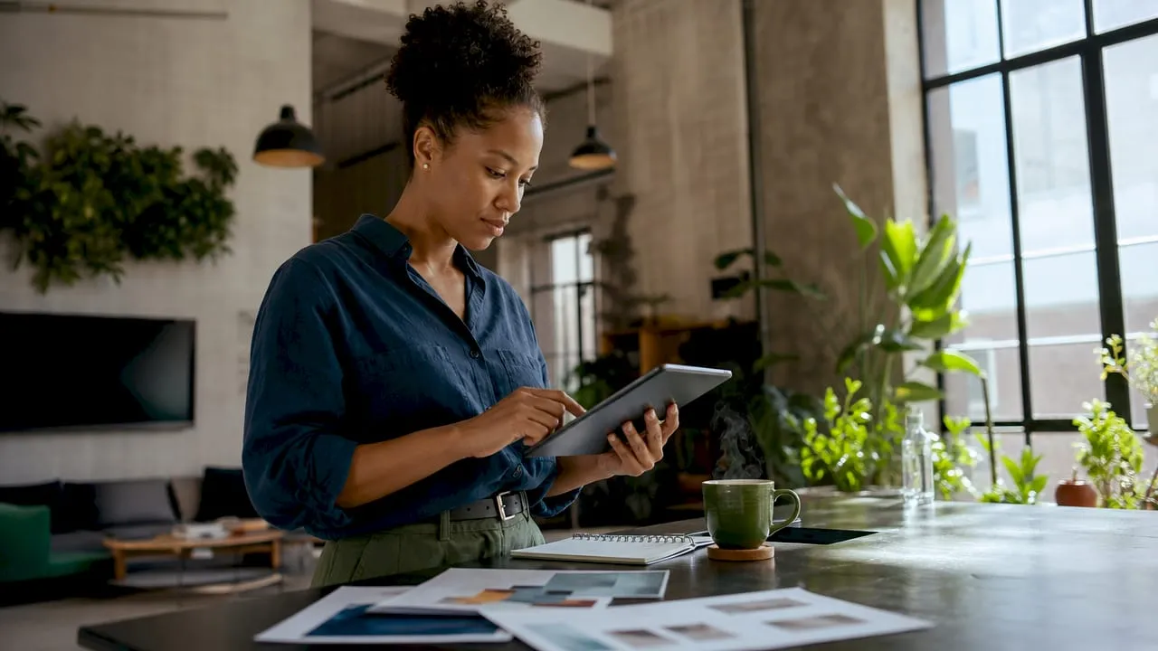 Woman reviewing ecommerce product content on tablet