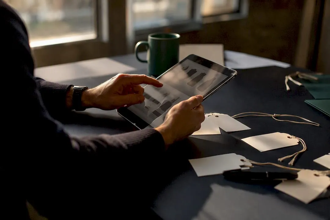 Hands comparing product labels at desk