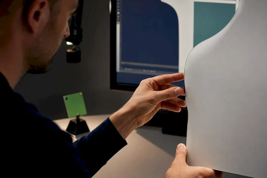 Hands inspecting a clean product cutout edge